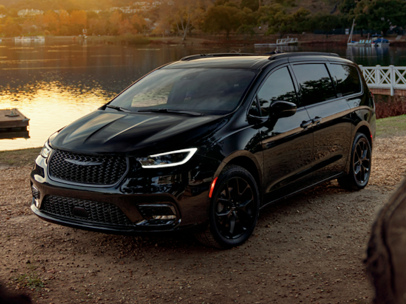 The 2024 Chrysler Pacifica beside a lake at sunset