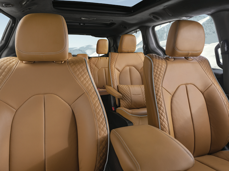 The interior of a 2024 Chrysler Pacifica with tan leather seats